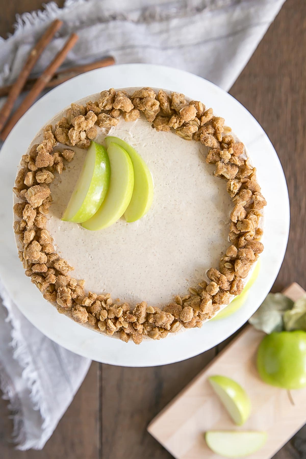 This Apple Crisp Cake pairs spice cake layers with a delicious homemade apple pie filling and apple crisp crumble. | livforcake.com Overhead shot of apple crisp cake.