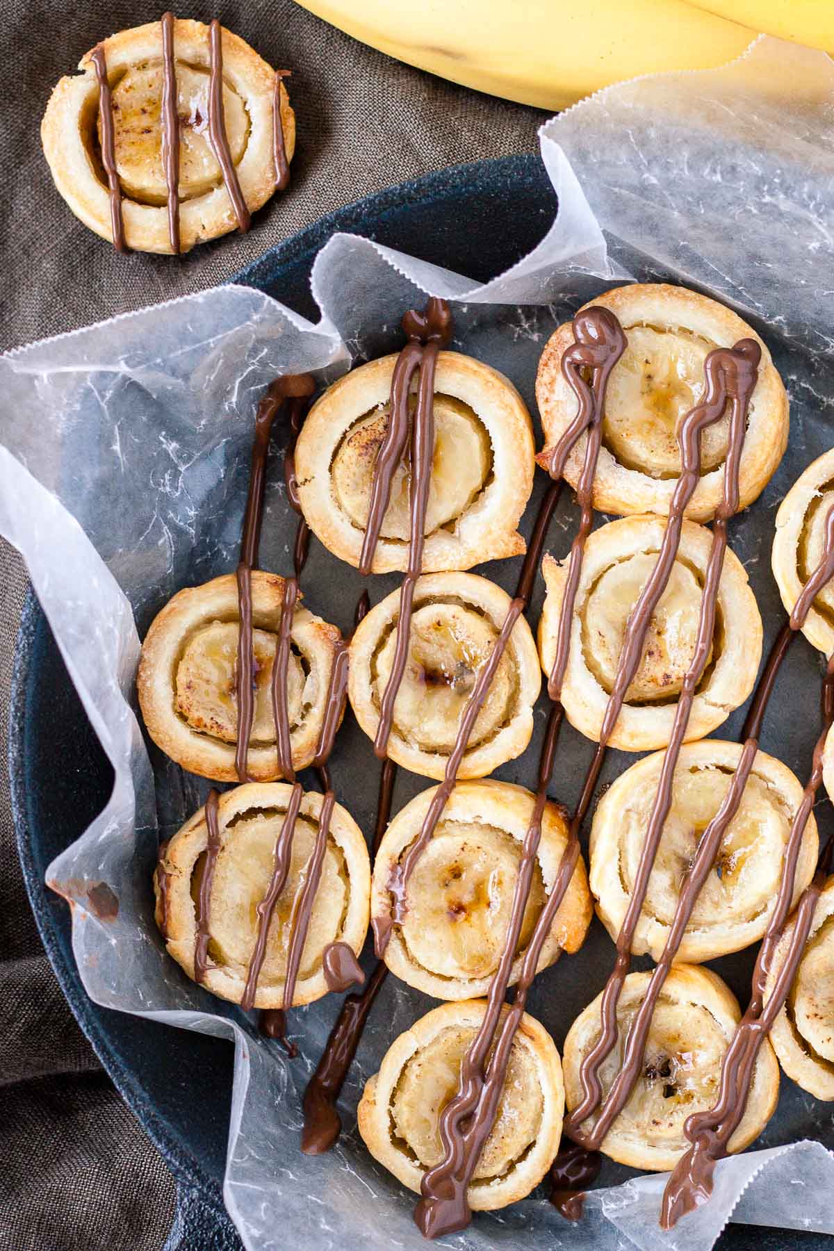 Overhead shot of banana bites in a cast iron pan.