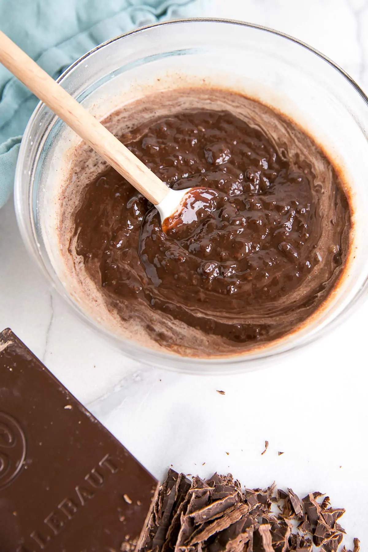 How to make Chocolate Ganache! A simple, two-ingredient recipe for a delicious frosting, filling, drip, or glaze. | livforcake.com Another photo of the ganache coming together, almost combined and smooth.