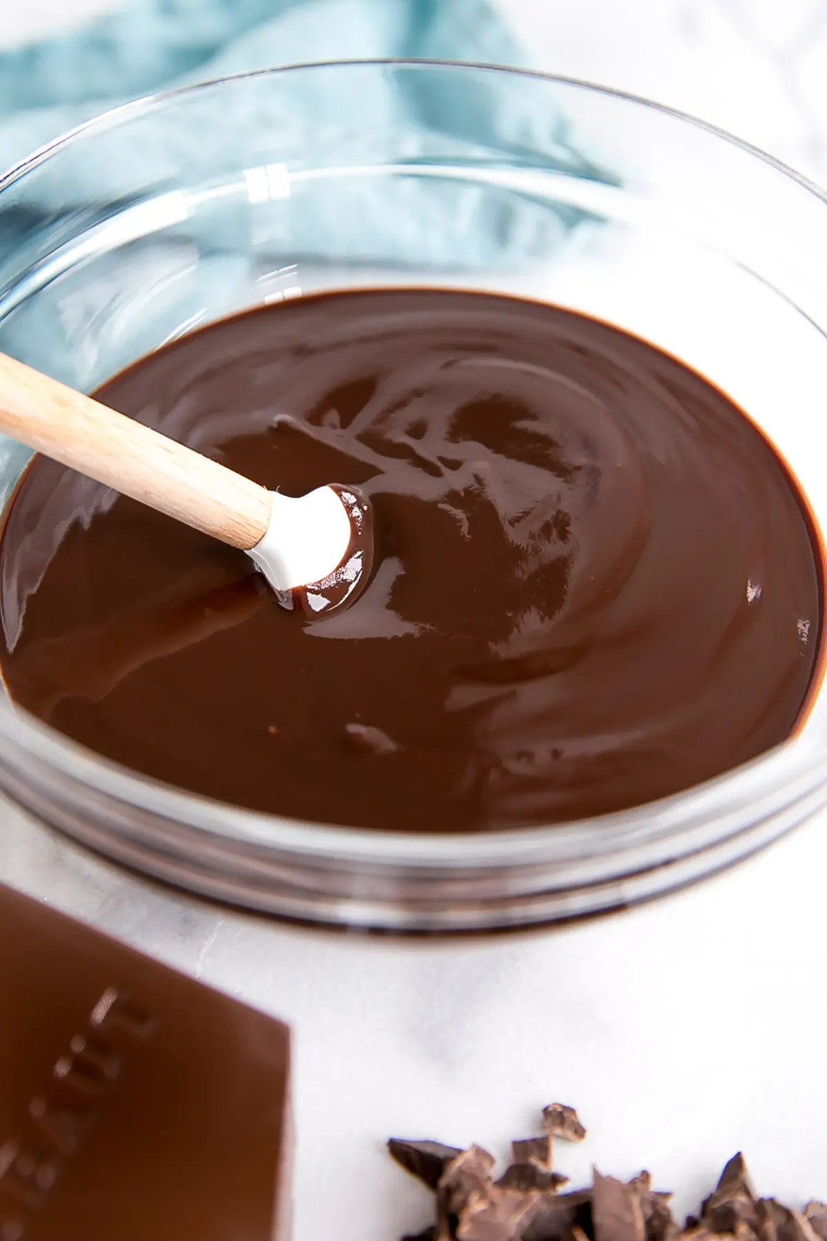 How to make Chocolate Ganache! A simple, two-ingredient recipe for a delicious frosting, filling, drip, or glaze. | livforcake.com Silky smooth ganache in a bowl.