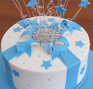 A blue and white cake on a table