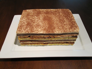 Twelve layer mocha cake on a white plate.