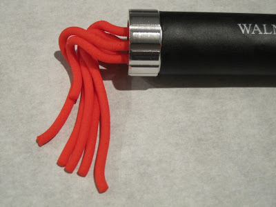 Red fondant coming out of the extruder.