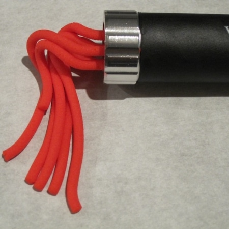 Red fondant coming out of the extruder.