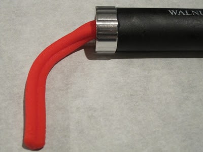 Red fondant coming out of the extruder.