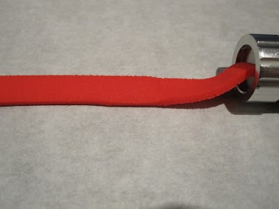 Red fondant coming out of the extruder.