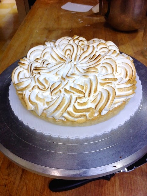 A cake sitting on top of a wooden table