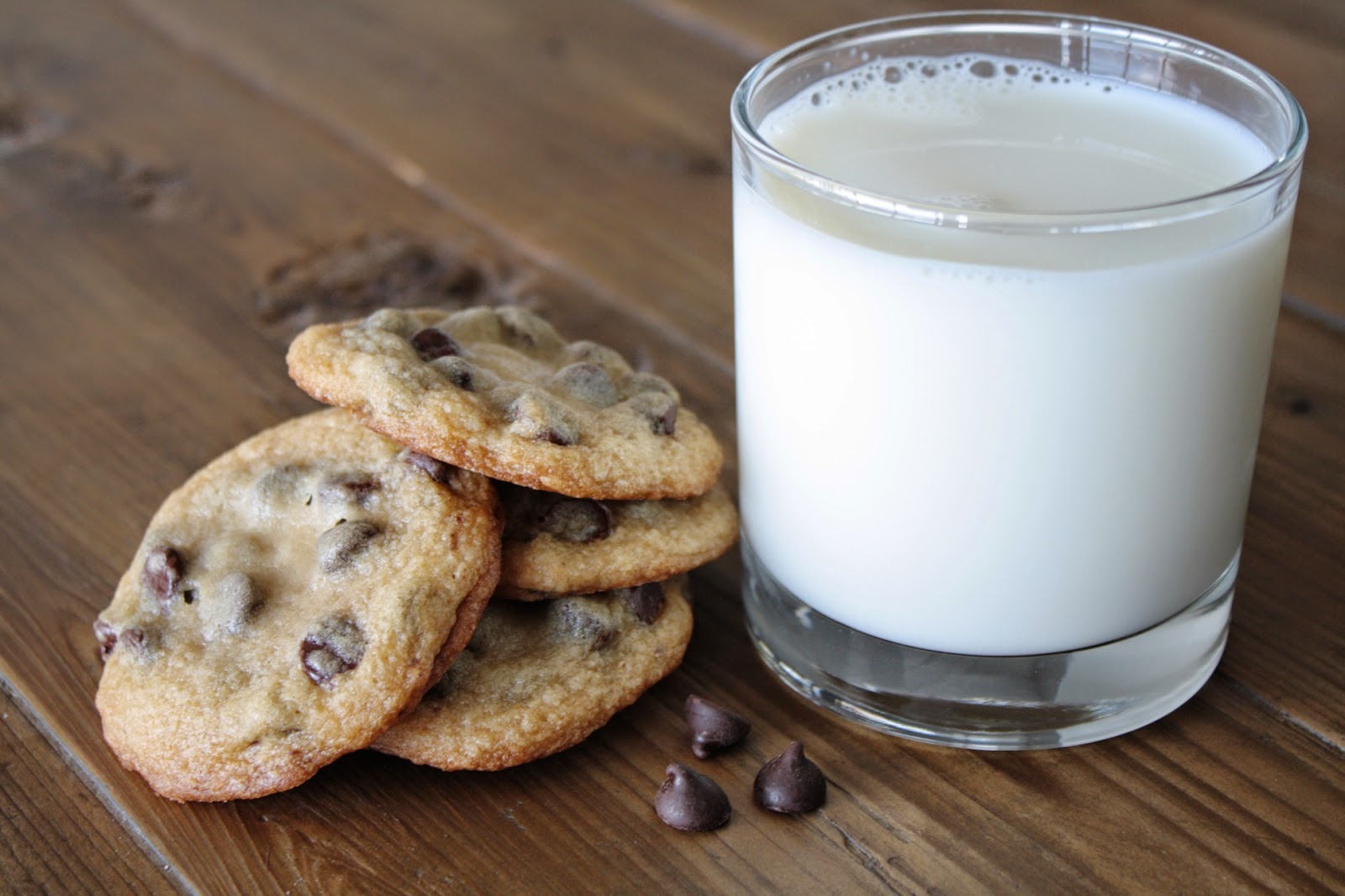 Cookies with a glass of milk beside them.