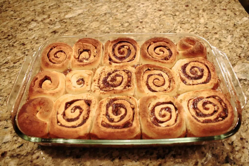 These easy overnight cinnamon rolls are a huge time saver! Make them in advance and pop them in the oven on Christmas morning. | livforcake.com Cinnamon rolls baked before turning out of pan