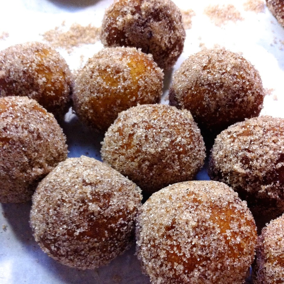 A donut covered in sugar