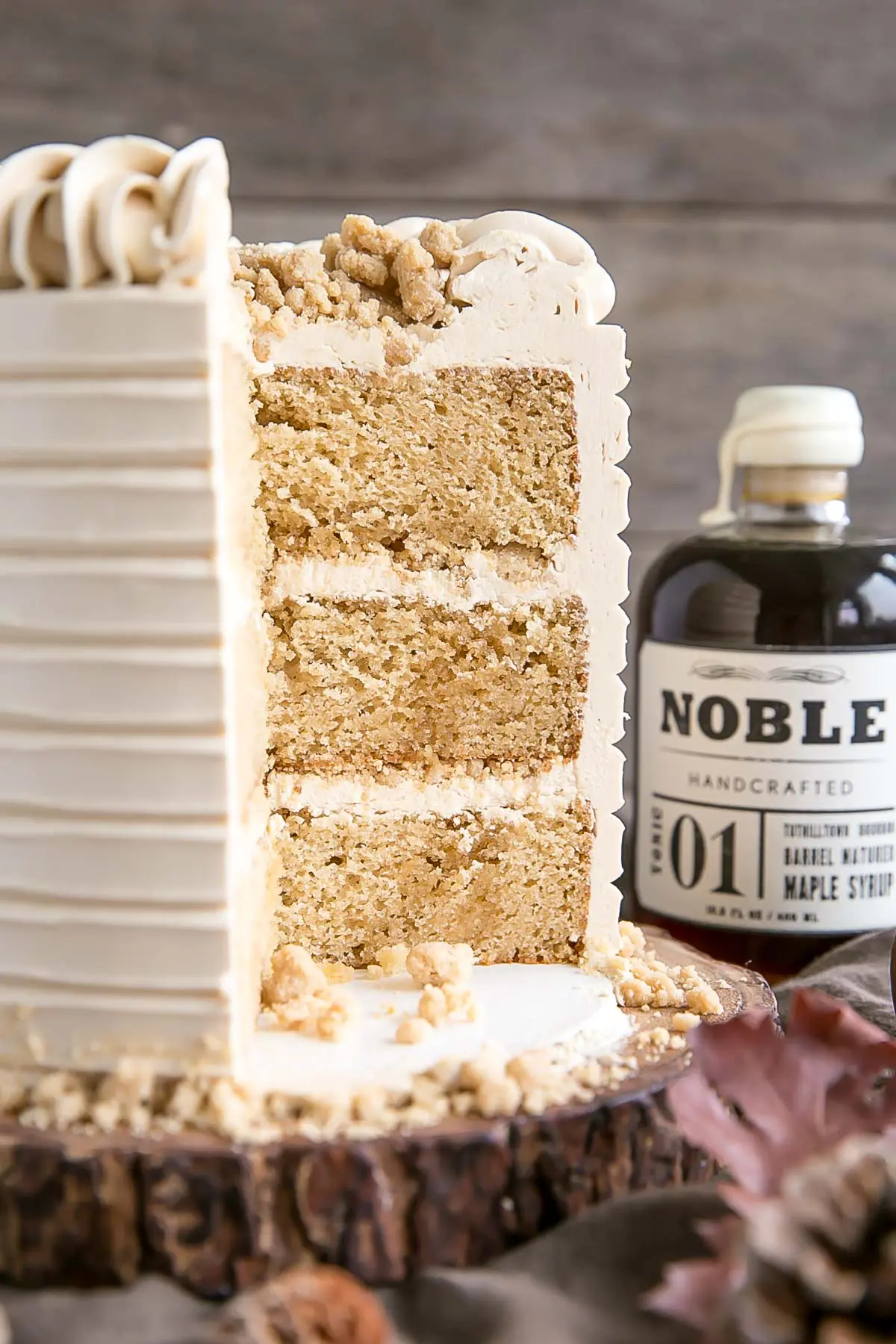 This Maple Cake is packed with pure, natural maple flavour throughout. Maple cake layers with a maple buttercream and maple streusel. | livforcake.com Cross section shot of maple cake.