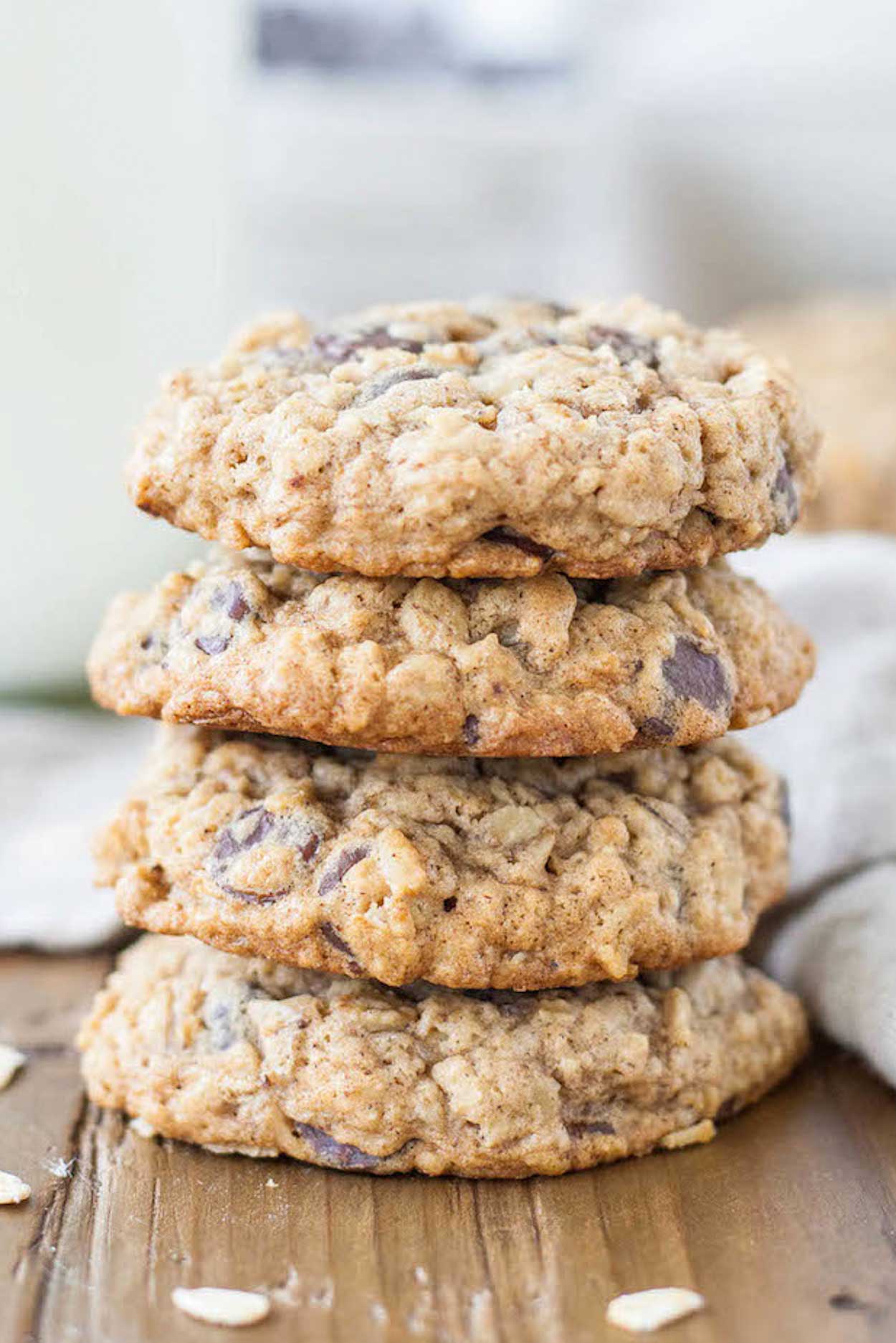 Close up of a stack of oatmeal chocolate chip cookies.