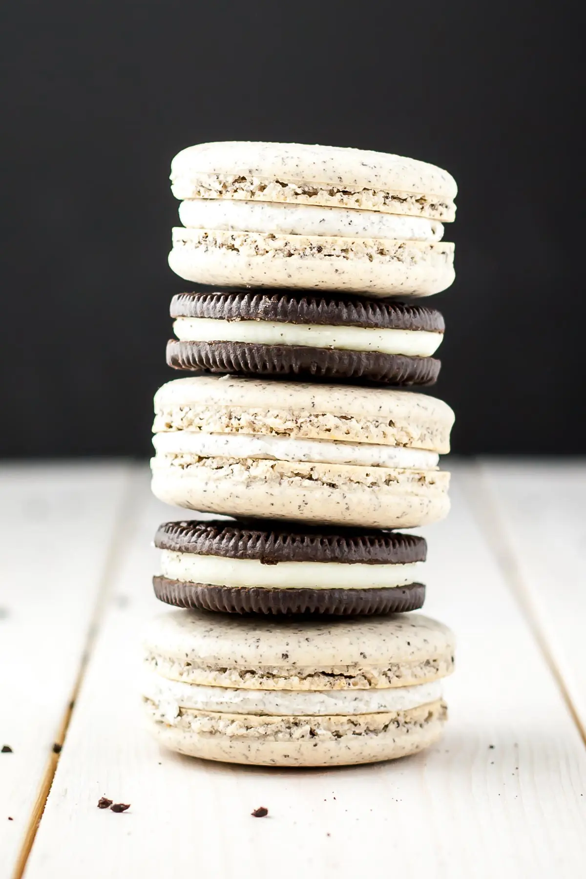 Oreo Macarons! Turn your favourite store-bought classics into something more decadent with these delicate Oreo macarons. | livforcake.com Alternating stack of macarons with Oreo cookies