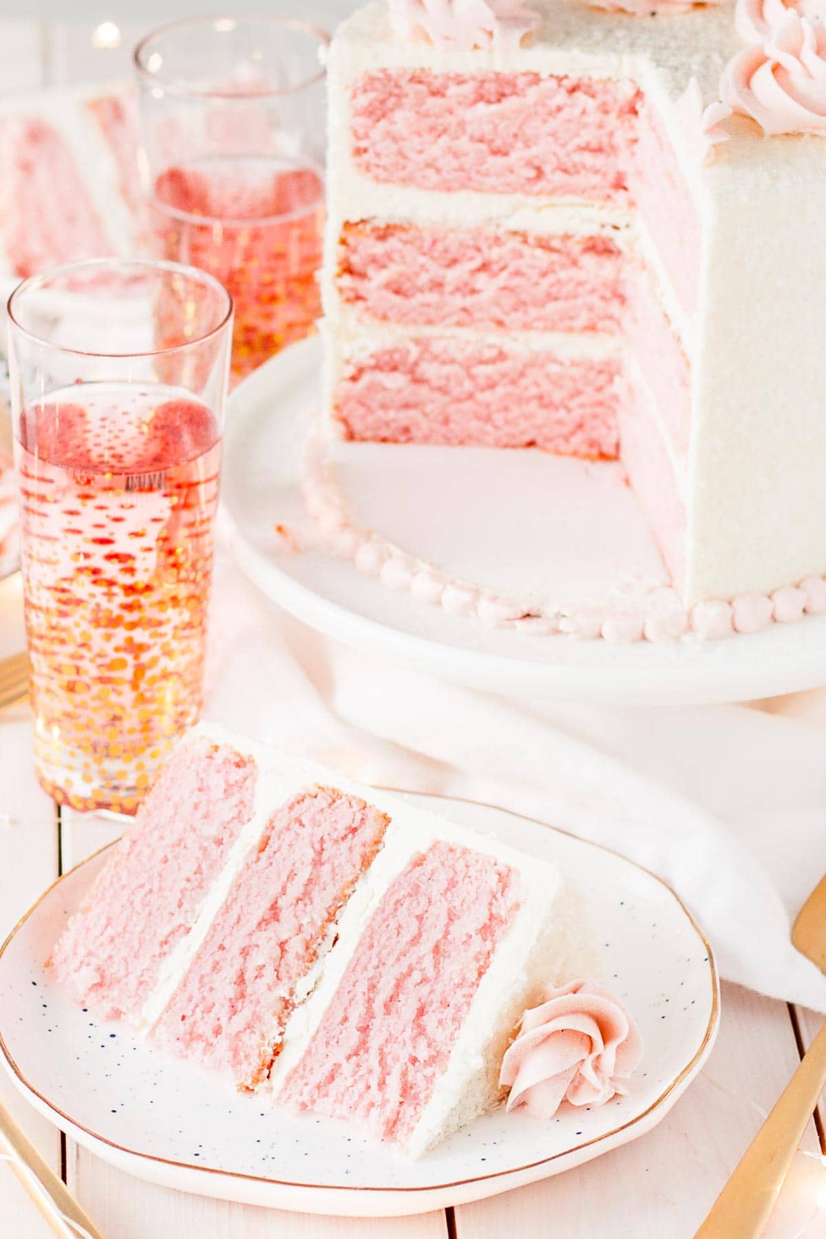 This Pink Champagne Cake is the perfect way to celebrate any occasion or holiday! A champagne infused cake with a classic vanilla buttercream. | livforcake.com Three layers of Pink Champagne Cake with vanilla swiss meringue buttercream.
