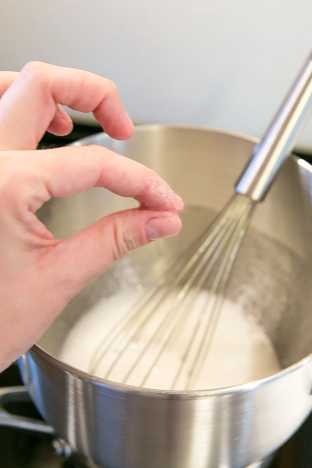 This tutorial on how to make Swiss Meringue buttercream is the only resource you'll need to make the smoothest, silkiest frosting! | livforcake.com Finger test for graininess