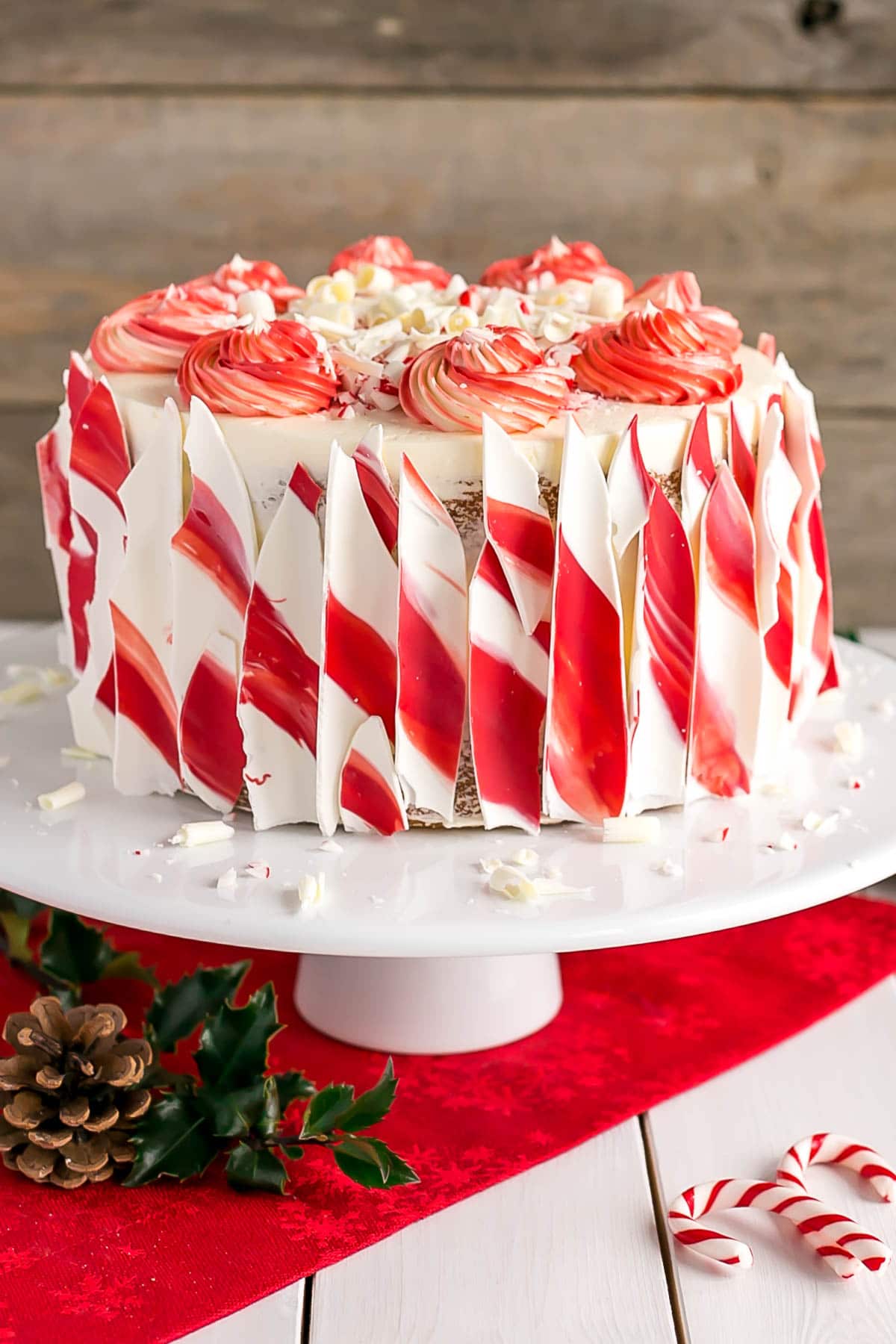 This White Chocolate Candy Cane Cake is the perfect addition to your holiday celebrations! | livforcake.com White Chocolate Candy Cane Cake with candy cane bark