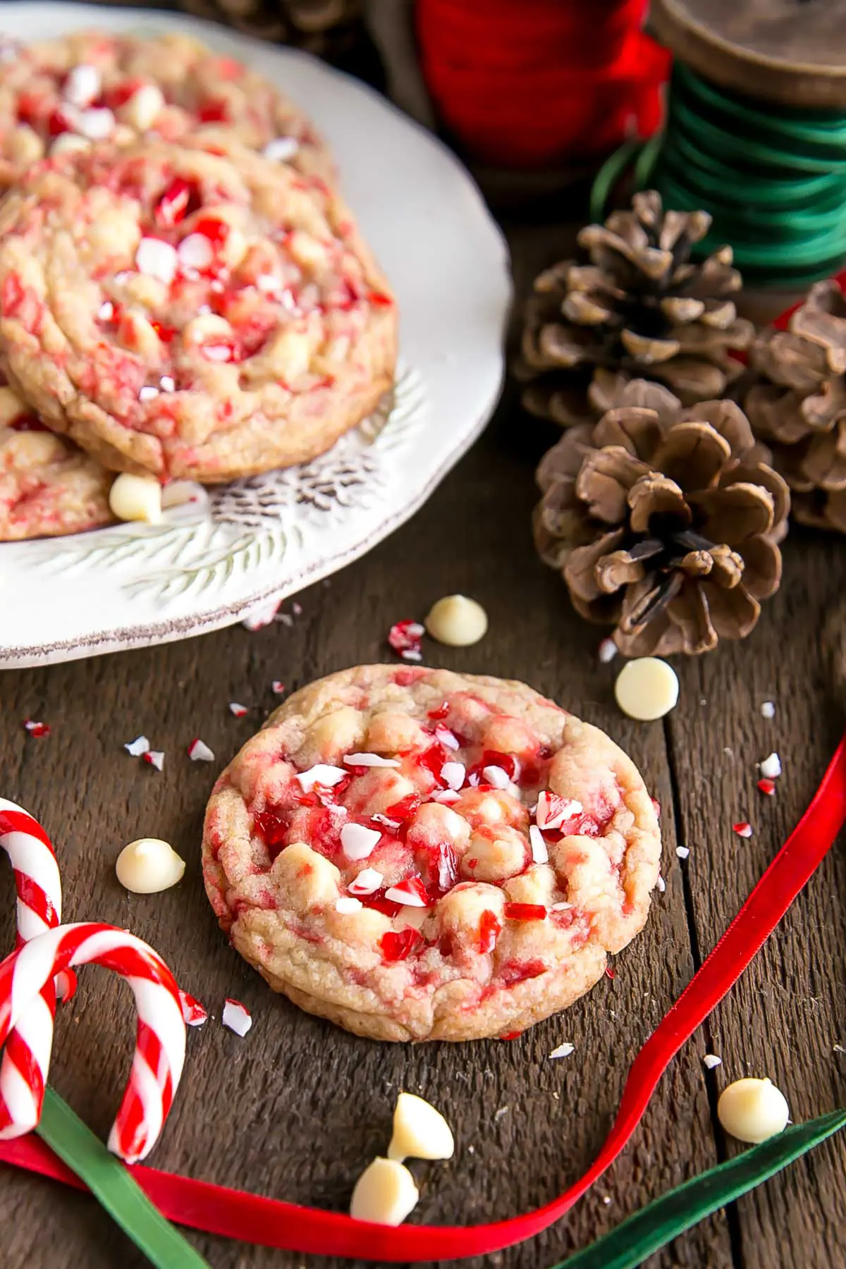 These White Chocolate Candy Cane Cookies are crispy, chewy and delicious. The perfect sweet treat for the holidays! | livforcake.com Crispy and chewy cookies with crushed candy canes and white chocolate chips.